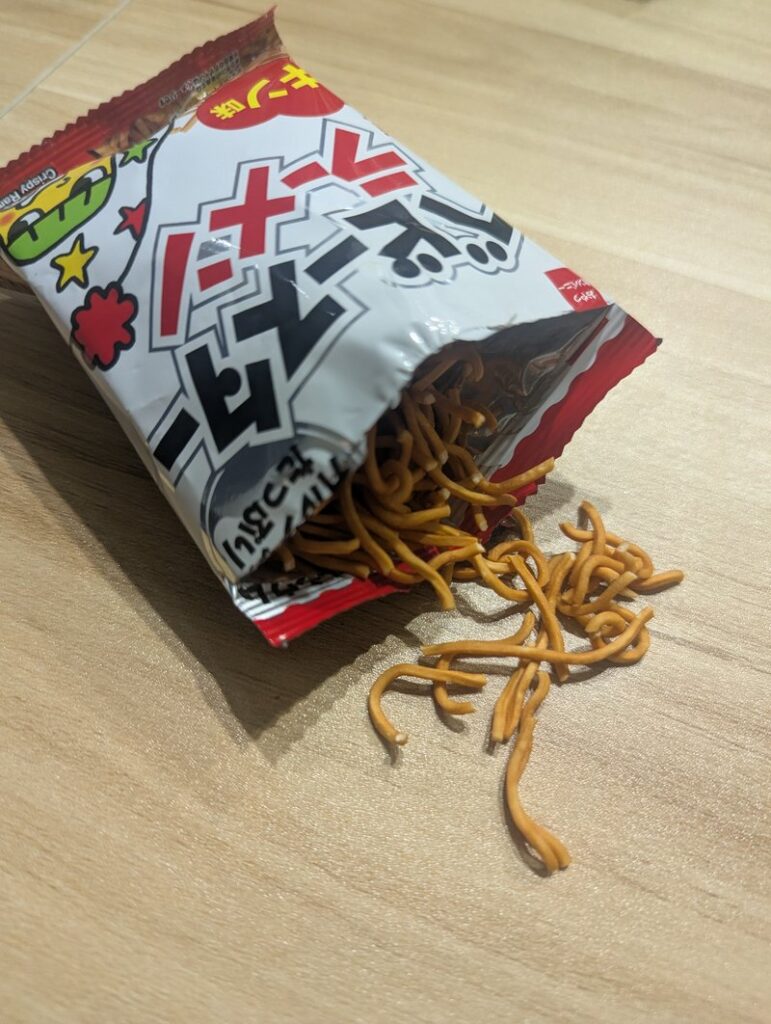 Baby Star Ramen crispy noodles spilling out of the open bag