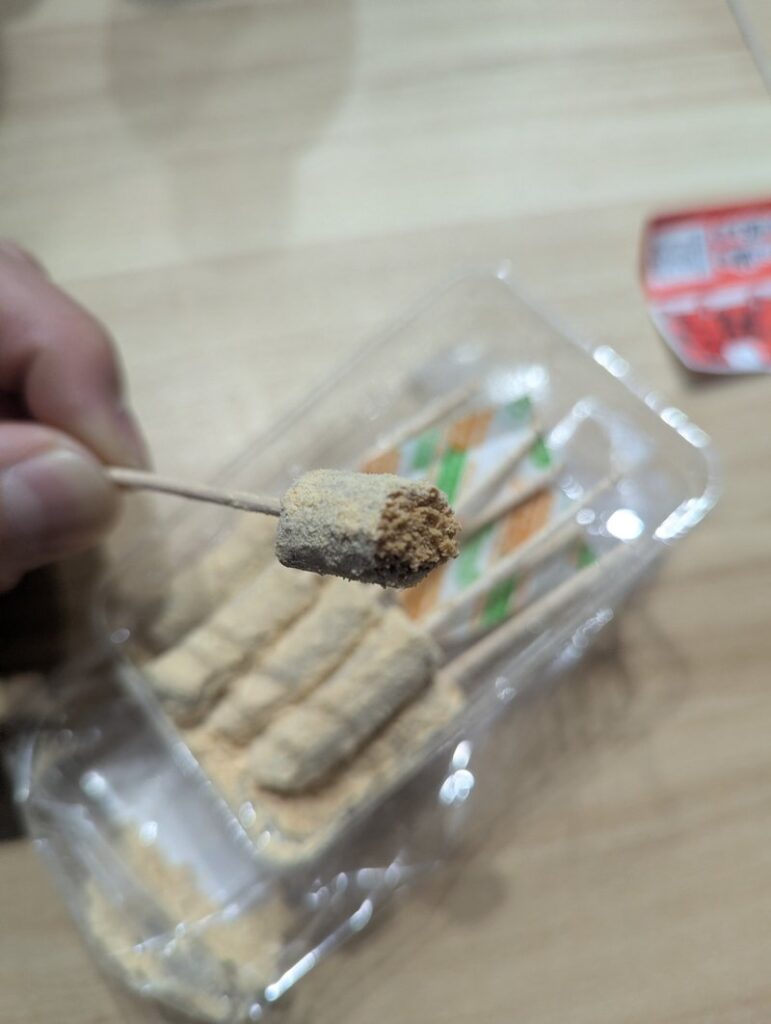 Bo-Kinako dagashi sticks in tray angled view kinako powder