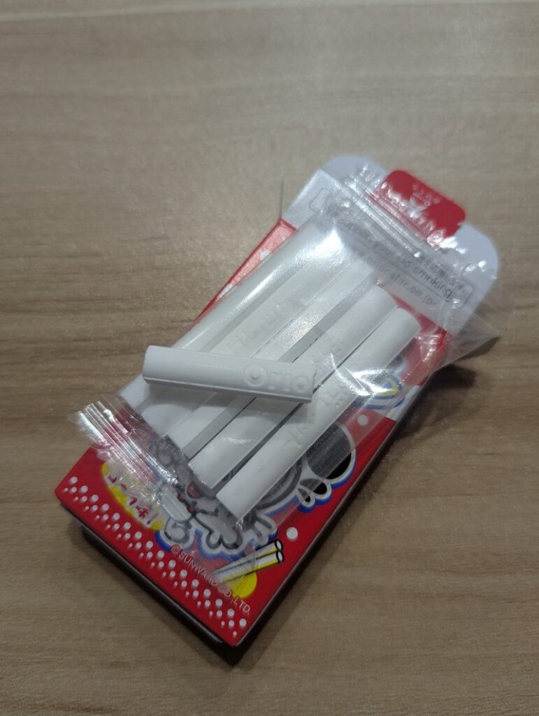 Cola Cigarette ramune candy sticks in packaging showing all six pieces