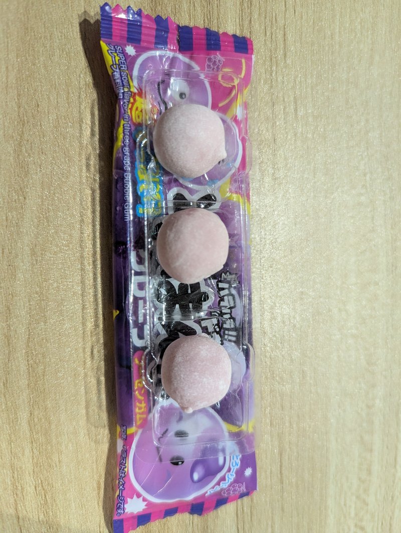 Three Sono Mama Grape gum pieces in the tray, each with different sourness