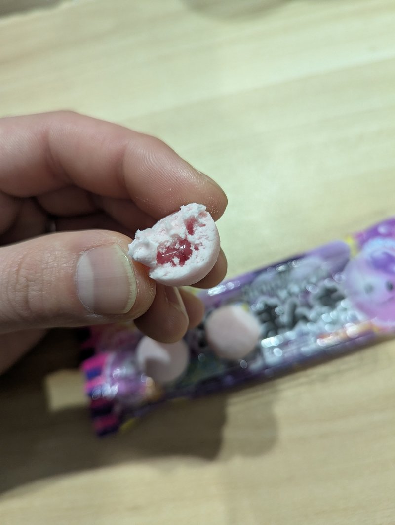 Sono Mama Grape gum bitten in half showing the grape paste filling inside