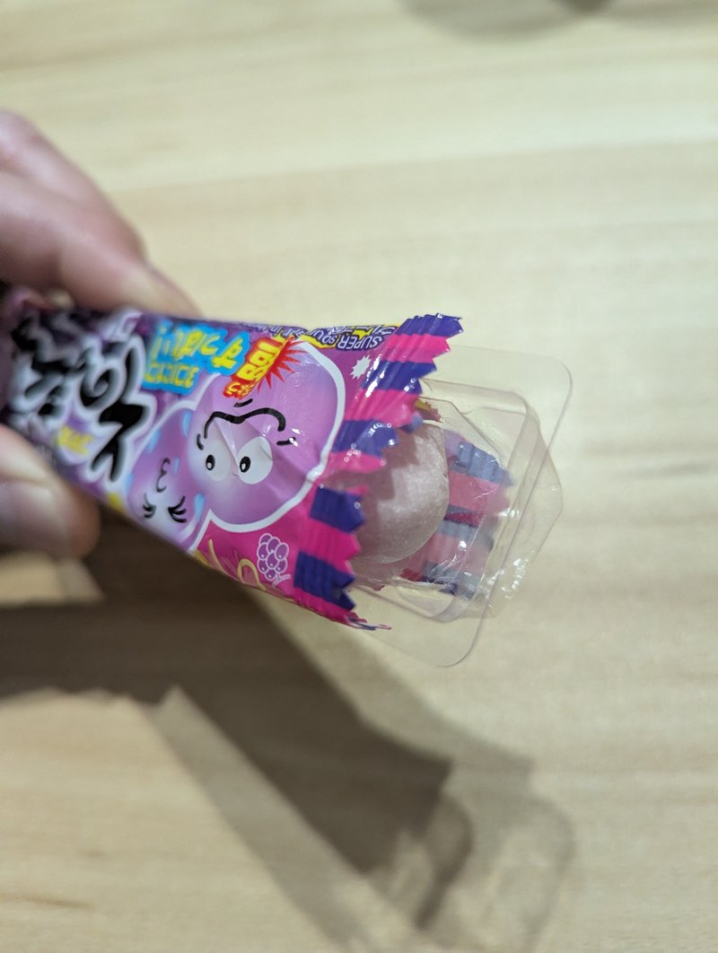 Opening a pack of Sono Mama Grape bubble gum