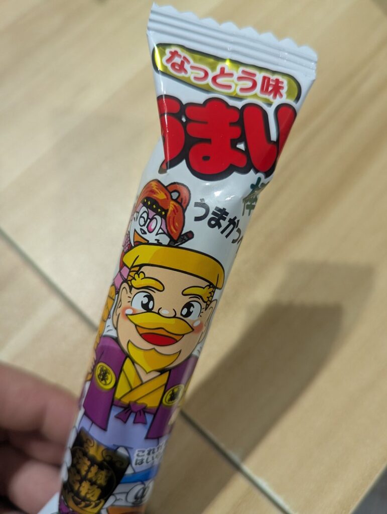 Umaibo Natto flavor Japanese dagashi corn puff snack