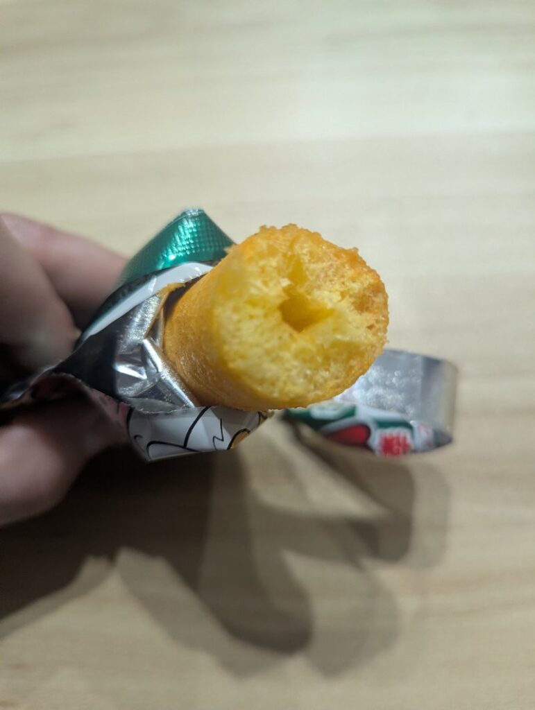 Umaibo Yasai Salad stick with a bite taken showing the crispy interior