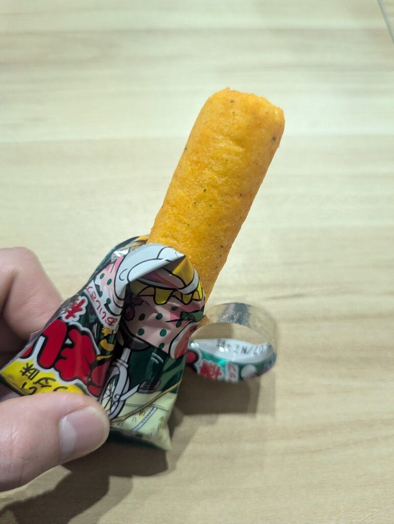 Umaibo Yasai Salad corn puff stick taken out of the package