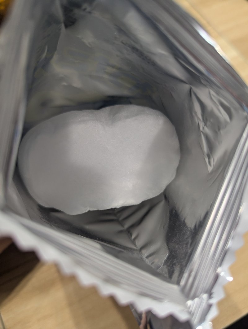 Looking inside a watagashi bag showing fluffy cotton candy
